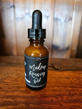 Natural oil-based makeup remover with rose water, jojoba oil, and coconut oil